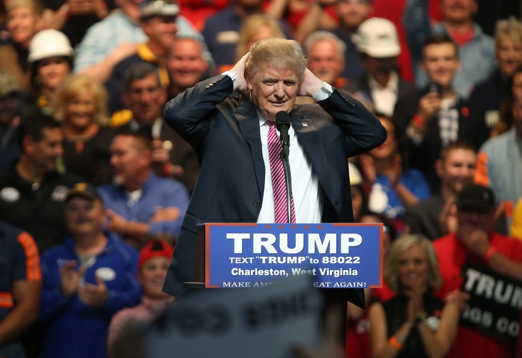 CHARLESTON, WV - MAY 05: Republican Presidential candidate Donald Trump plays with his hair during his rally at the Charleston Civic Center on May 5, 2016 in Charleston, West Virginia. Trump became the Republican presumptive nominee following his landslide win in indiana on Tuesday.(Photo by Mark Lyons/Getty Images)