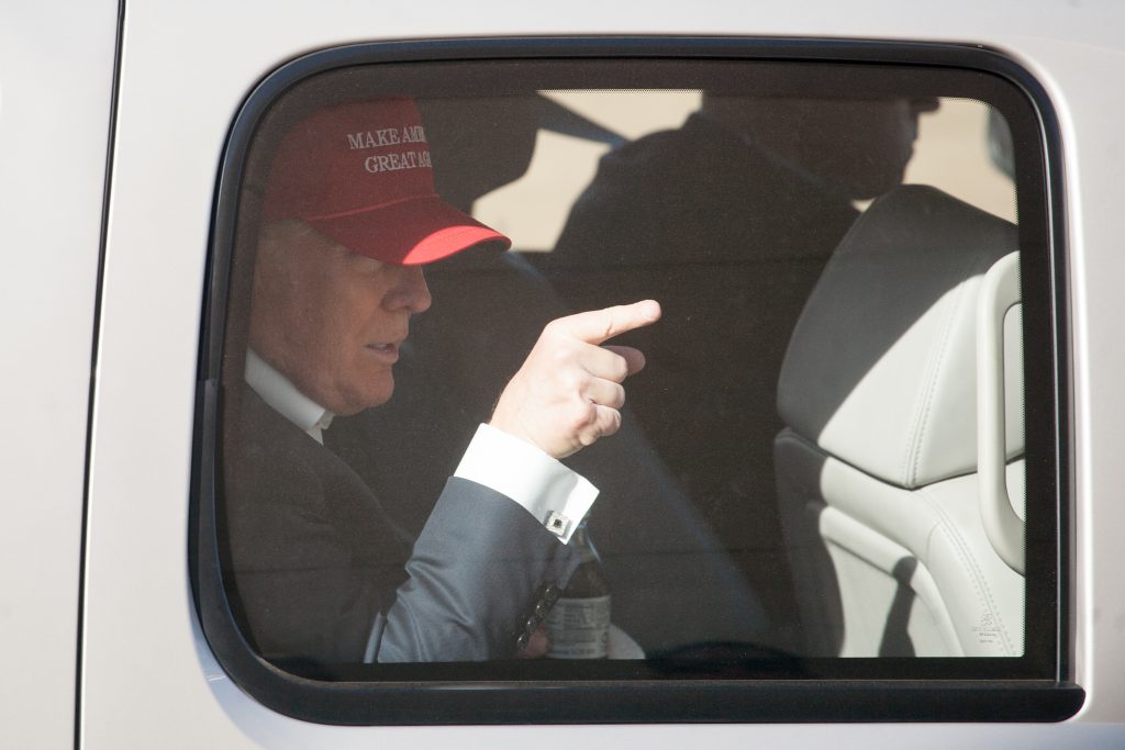 LYNDEN, WA - MAY 07: Republican presidential candidate Donald Trump gestures from his motorcade after a rally at the The Northwest Washington Fair and Event Center on May 7, 2016 in Lynden, Washington. Trump became the Republican presumptive nominee following his landslide win in Indiana on Tuesday. (Photo by Matt Mills McKnight/Getty Images)