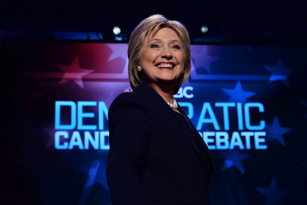 US Democratic presidential candidates Hillary Clinton arrives on stage before participating in the MSNBC Democratic Candidates Debate at the University of New Hampshire in Durham on February 4, 2016. Clinton and Sanders face off on February 4, in the first debate since their bruising Iowa clash that the former secretary of state won by a hair, as they gear for a battle royale in New Hampshire. / AFP / JEWEL SAMAD / ALTERNATE CROP (Photo credit should read JEWEL SAMAD/AFP/Getty Images)