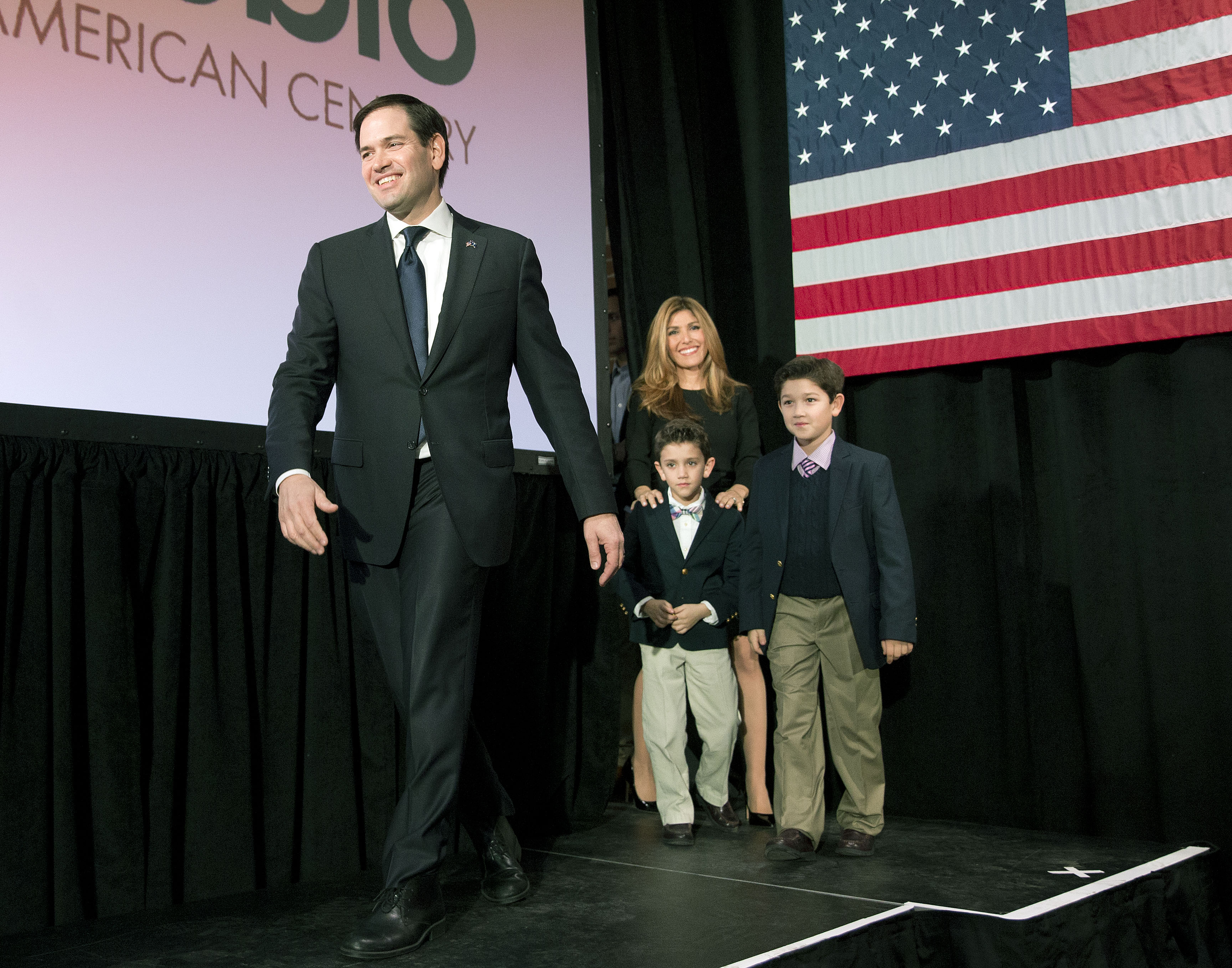 Republican presidential candidate Sen. Marco Rubio, R-Fla, is followed on stage by his wife Jeanette and sons Dominick, left, and Anthony during an election-night rally Saturday, Feb. 20, 2016, in Columbia, S.C. (AP Photo/John Bazemore)